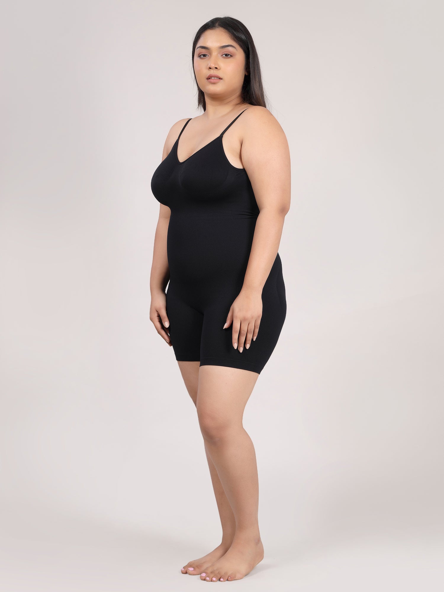 Black open back bodysuit shapewear showing deep low-back design