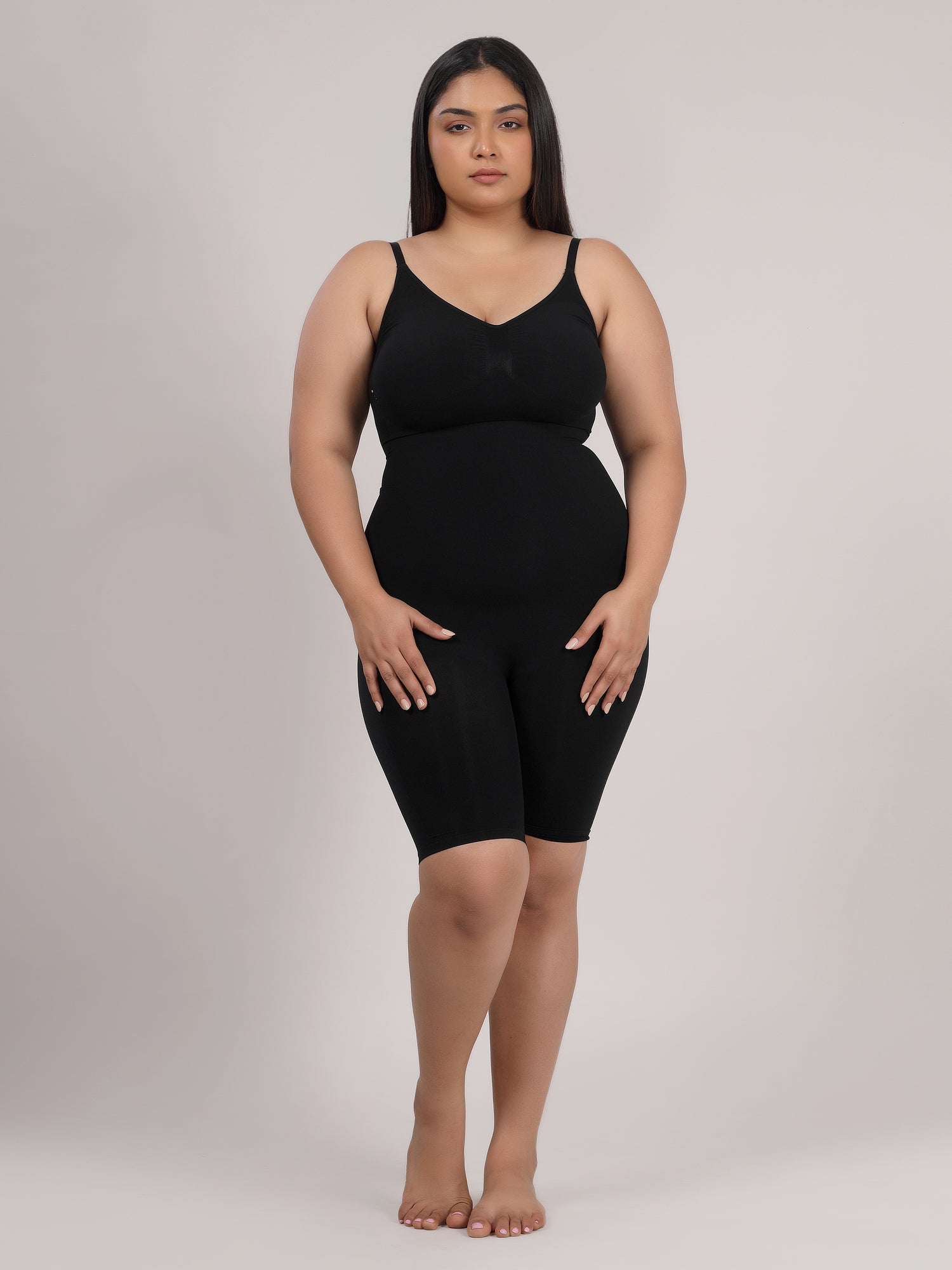 Black full-body shaper bodysuit side view showing tummy and waist control