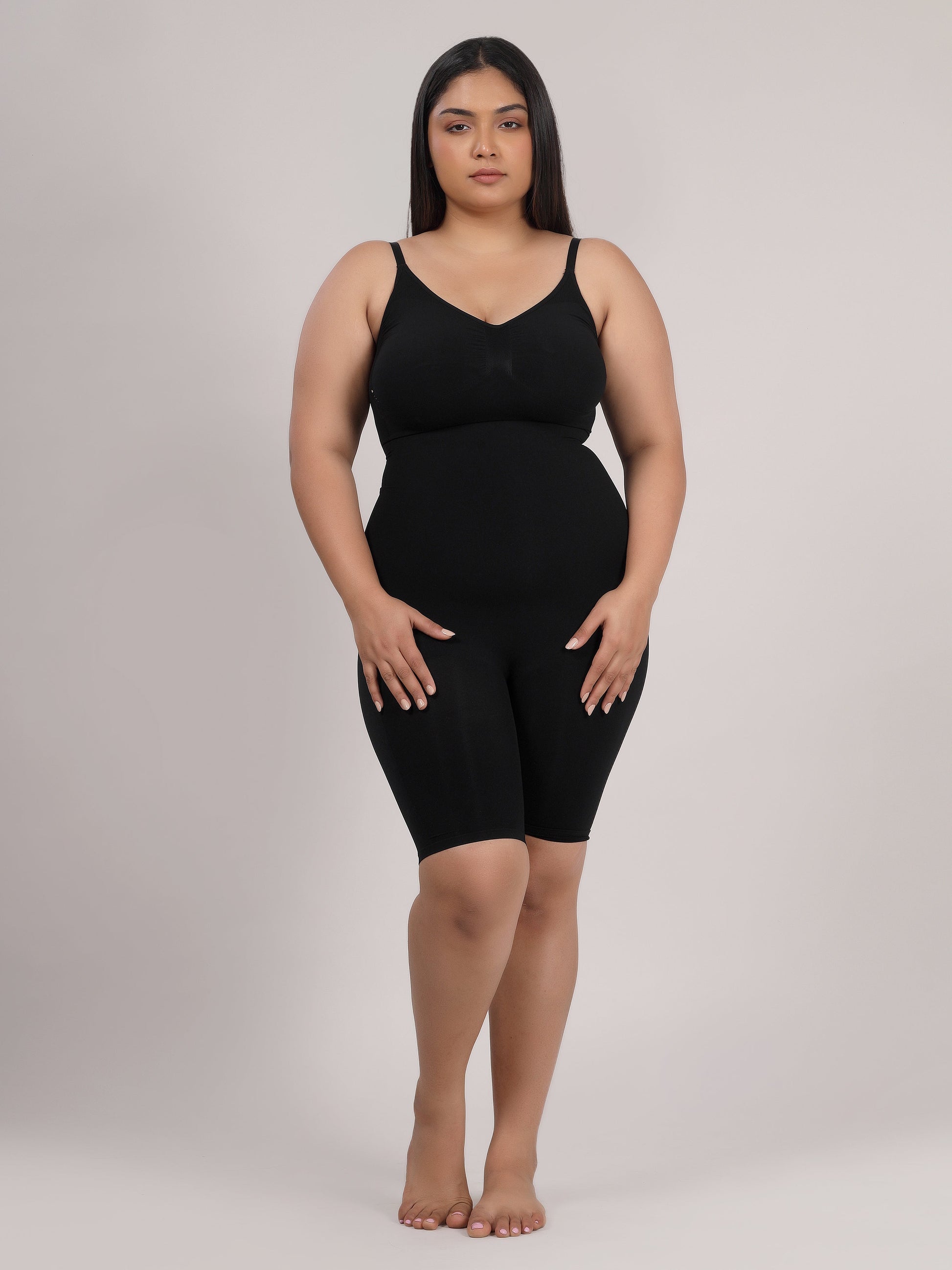 Black full-body shaper bodysuit side view showing tummy and waist control