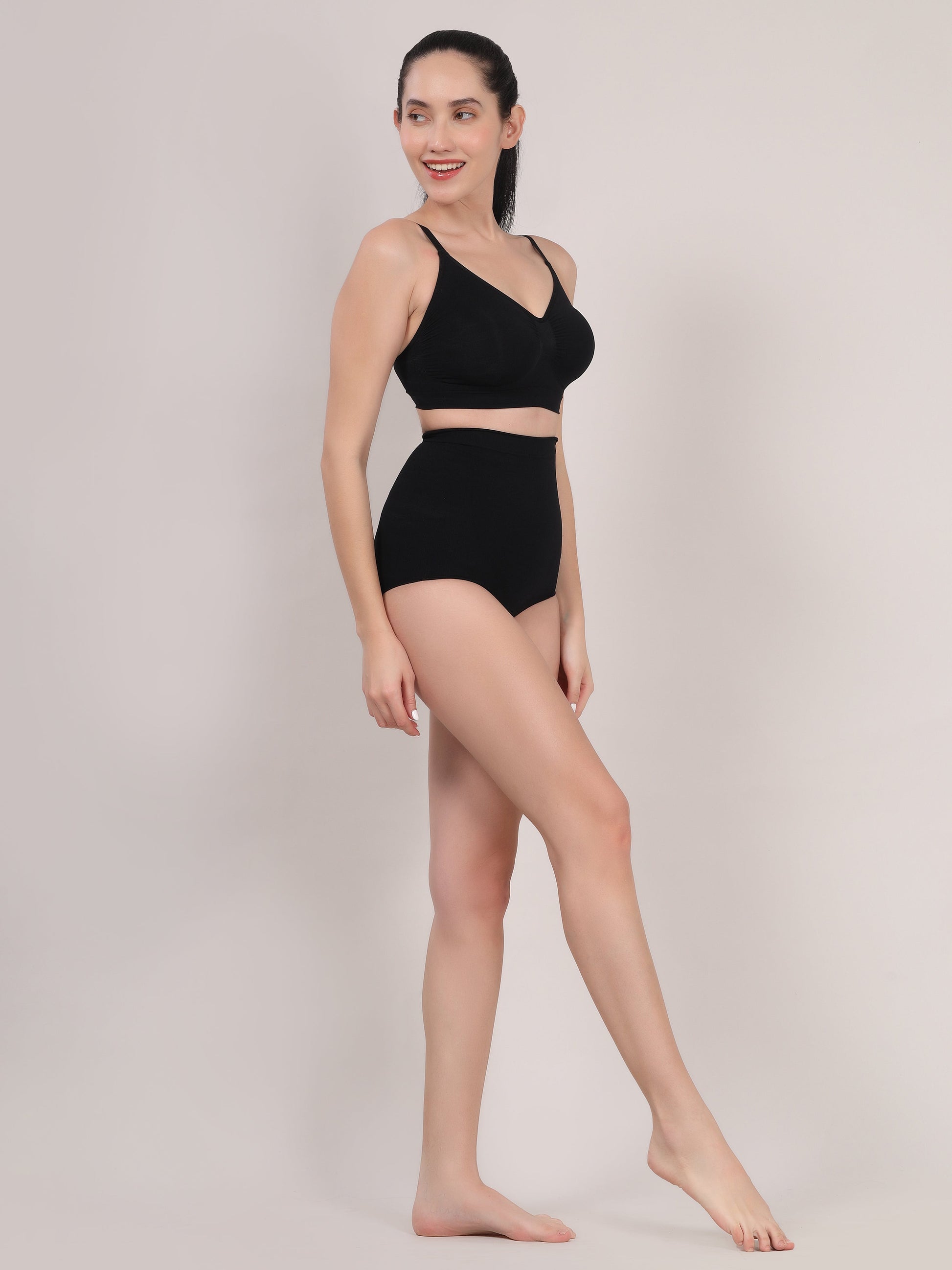 Black seamless shaping brief back view showing smooth fit